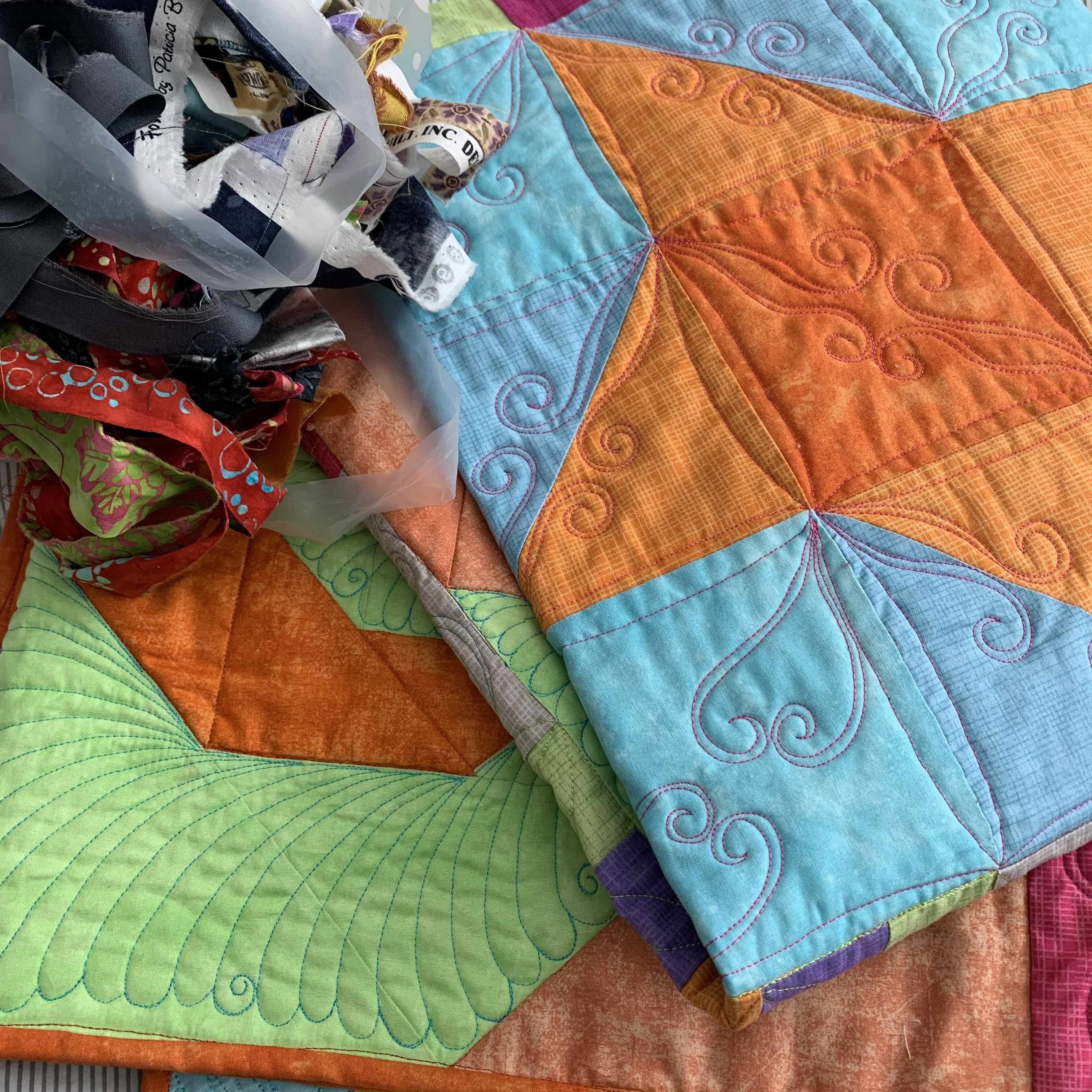 Image of a quilt and fabric scraps by Teri Lucas