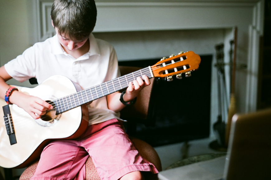 music student taking online guitar lessons with a Lessonface teacher