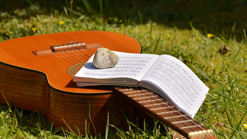 New music in the sunshine on a guitar