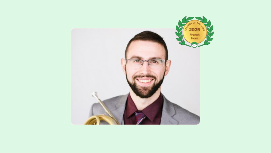 Image of Olivier Blakney with his French Horn and Lessonface Teacher of the Year badge