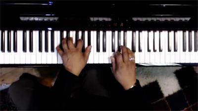 An over the keys shot using an external webcam for multicam set up for online piano lessons