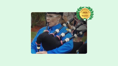 Image of Toni Cline playing the bagpipes with her Lessonface Teacher of the Year Bagpipes badge