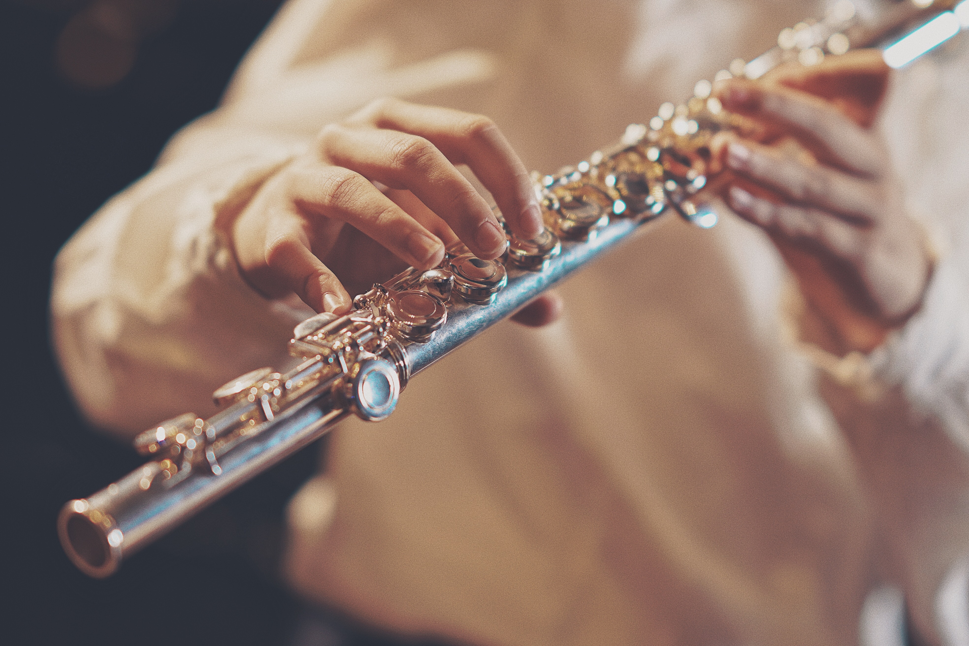 person playing flute in concert