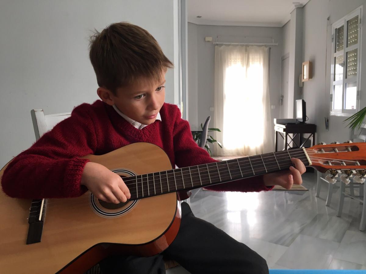 young child with guitar