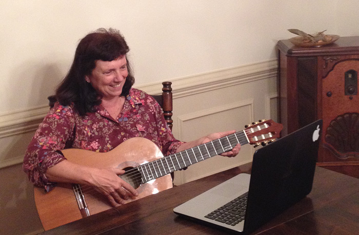 lady with guitar and computer