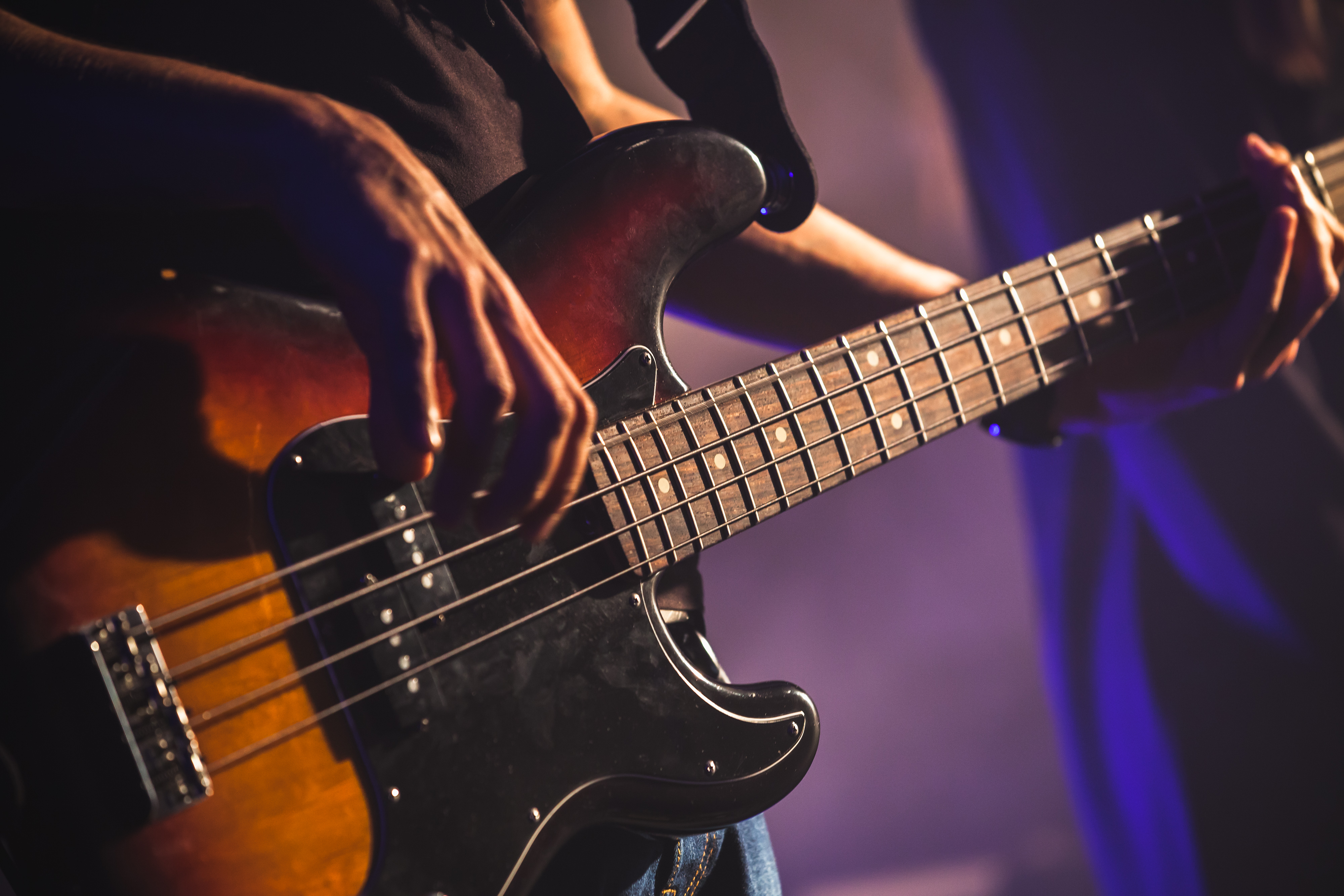 Person playing a fender bass